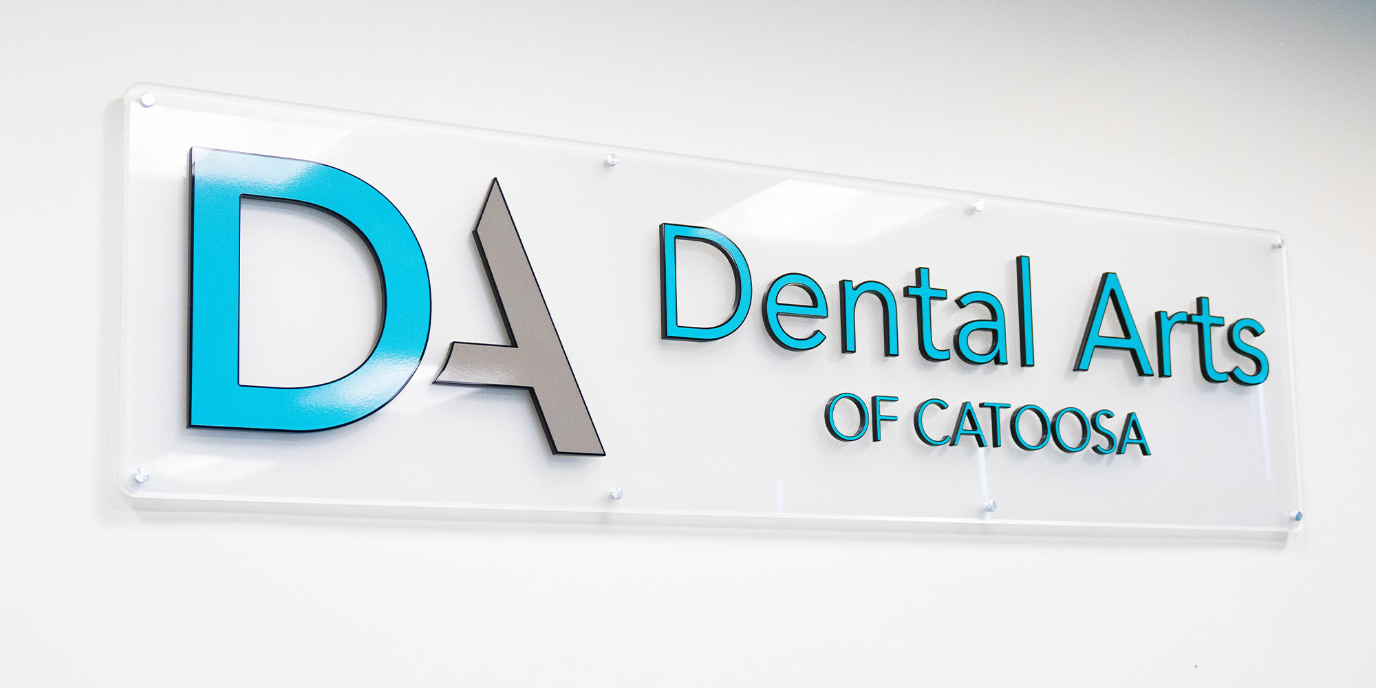 close up billboard of dental center name and logo