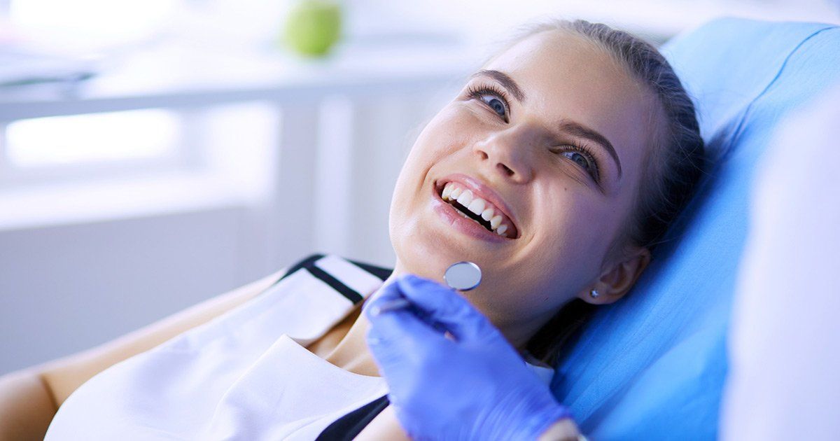 dental veneers women sitting in chair