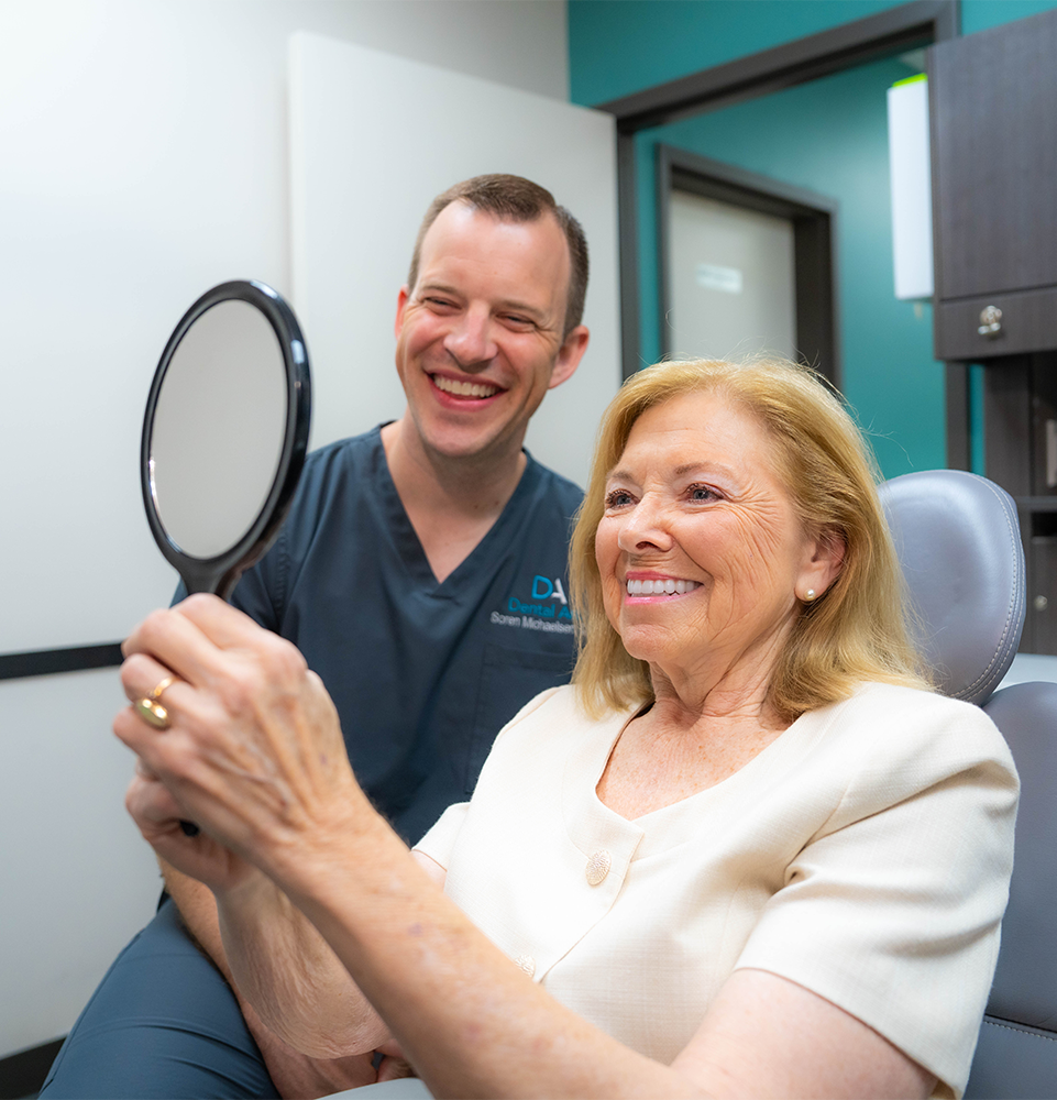 patient smiling brightly after their dental procedure within the dental center