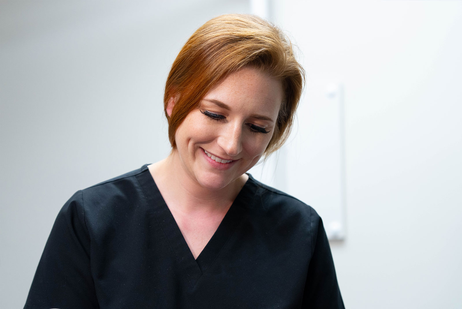 close up of staff member examining patient