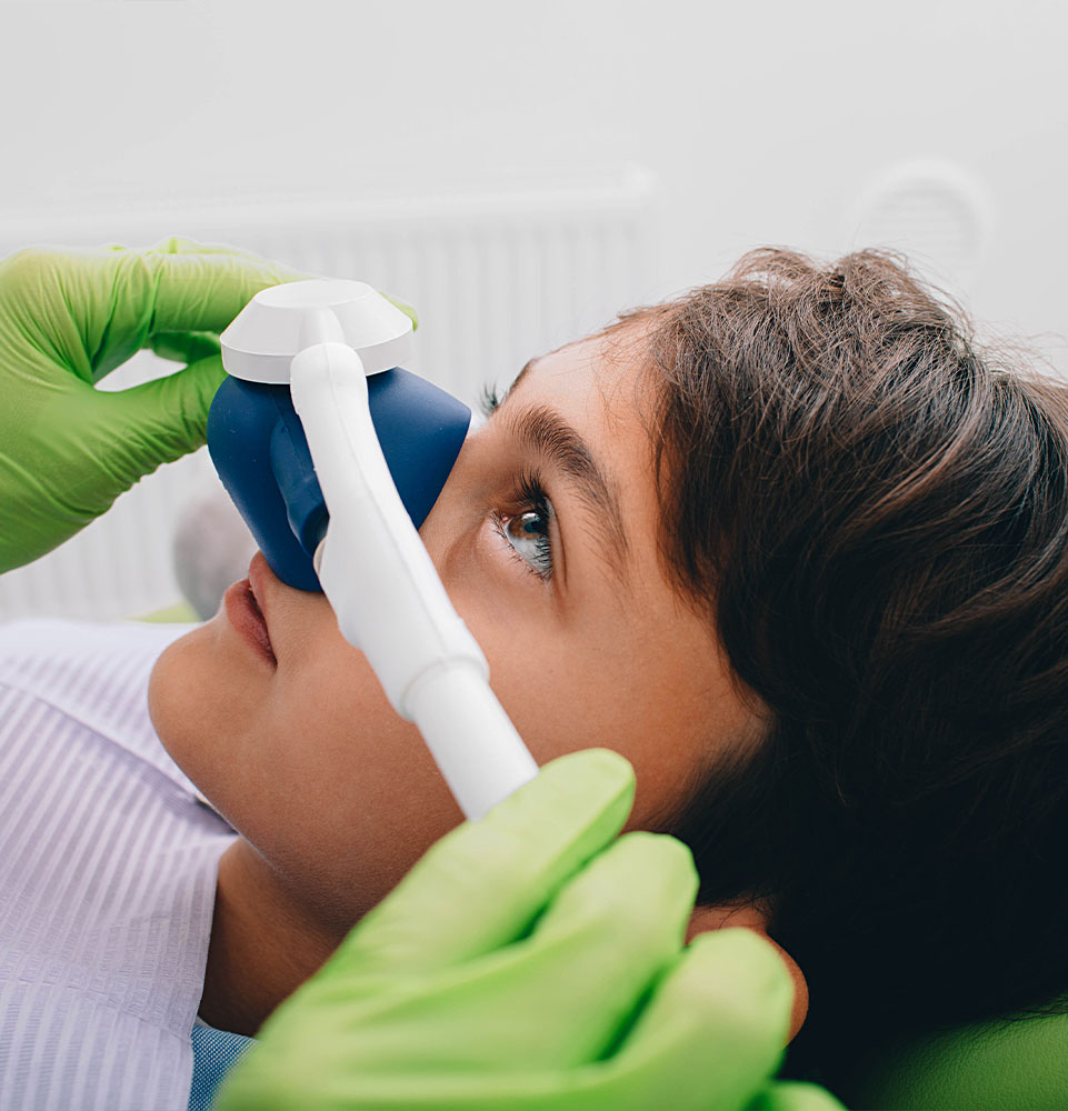 child patient getting prep for dental sedation for procedure