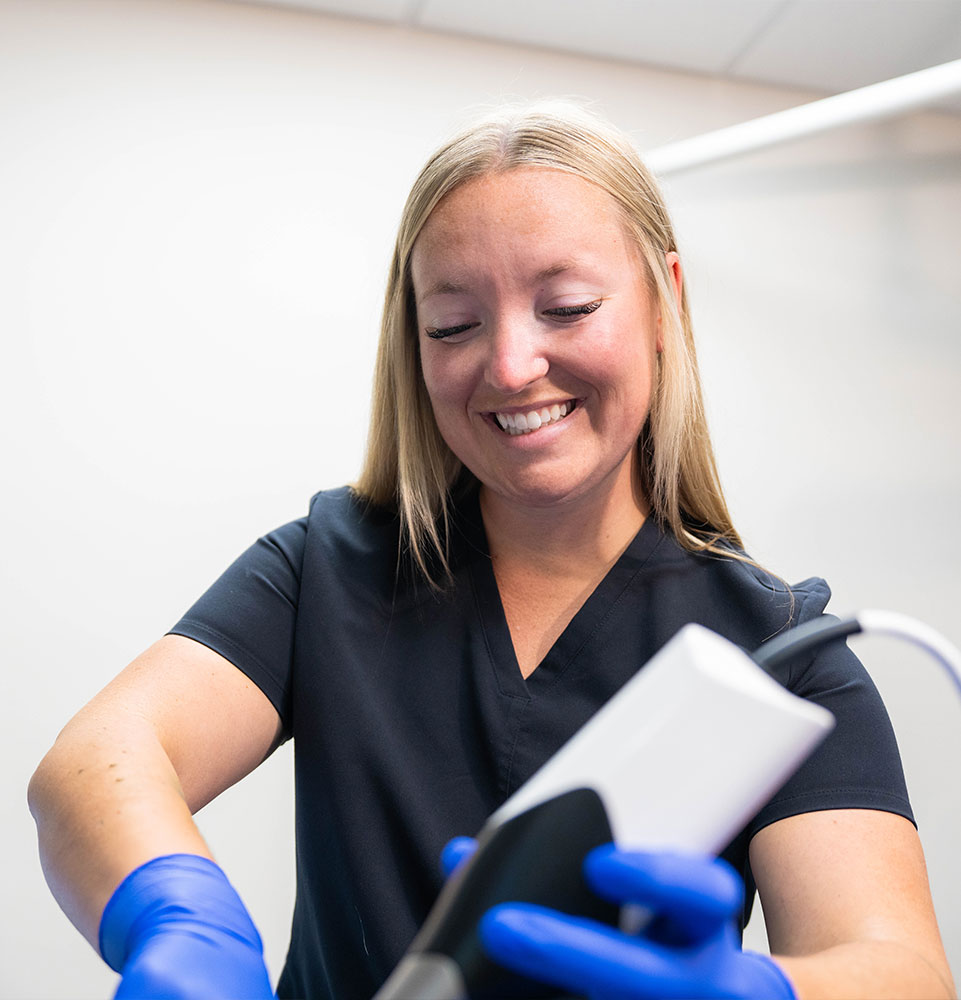 staff member doing dental examination on patient