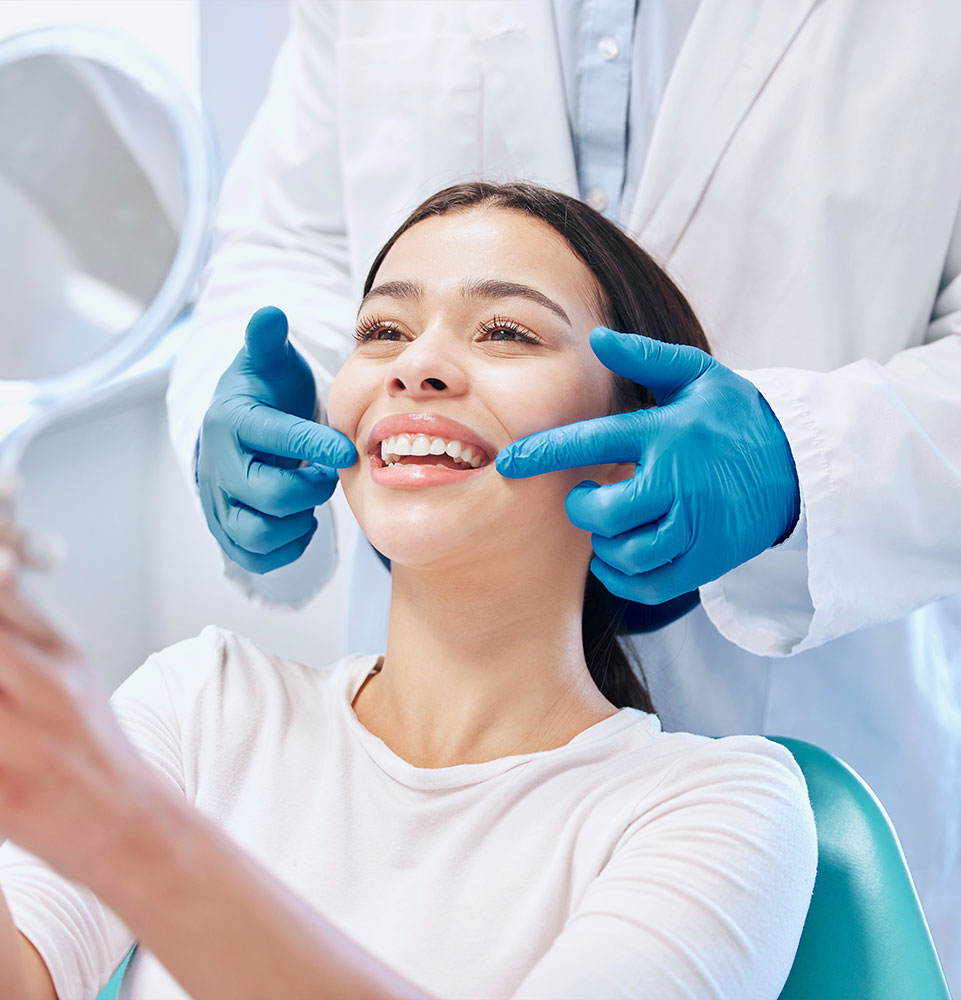 patient smiling brightly after their dental procedure within the dental center