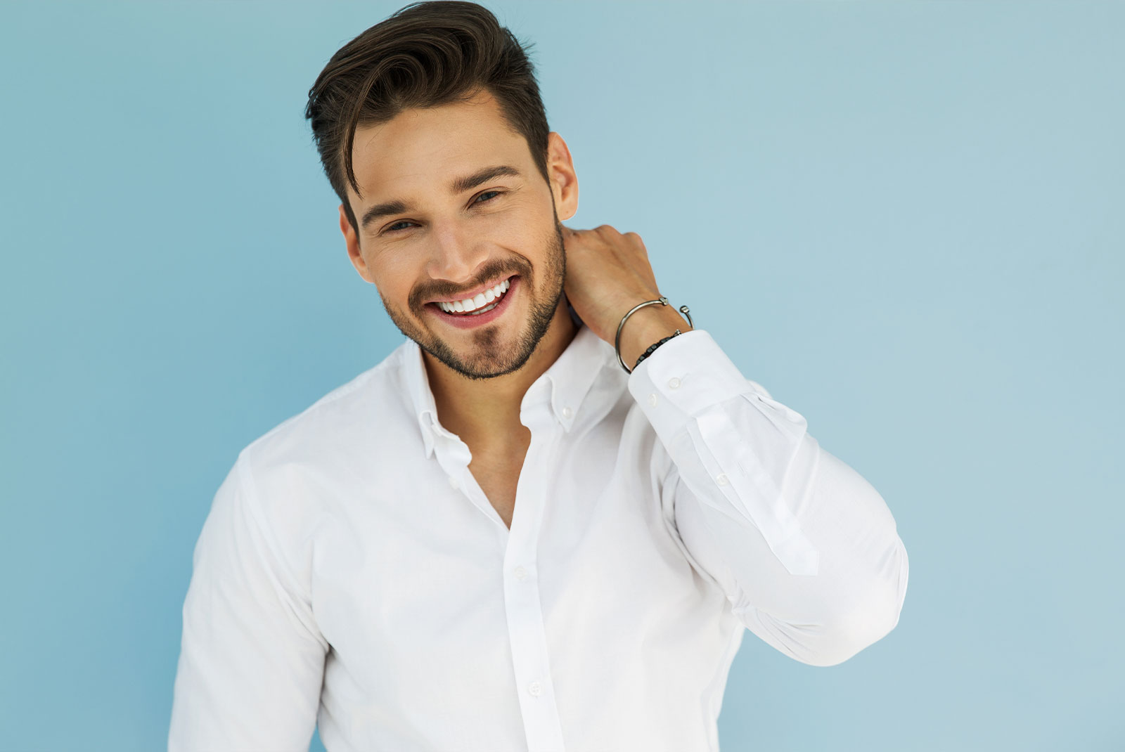 close up of young handsome male smiling brightly for their photoshoot