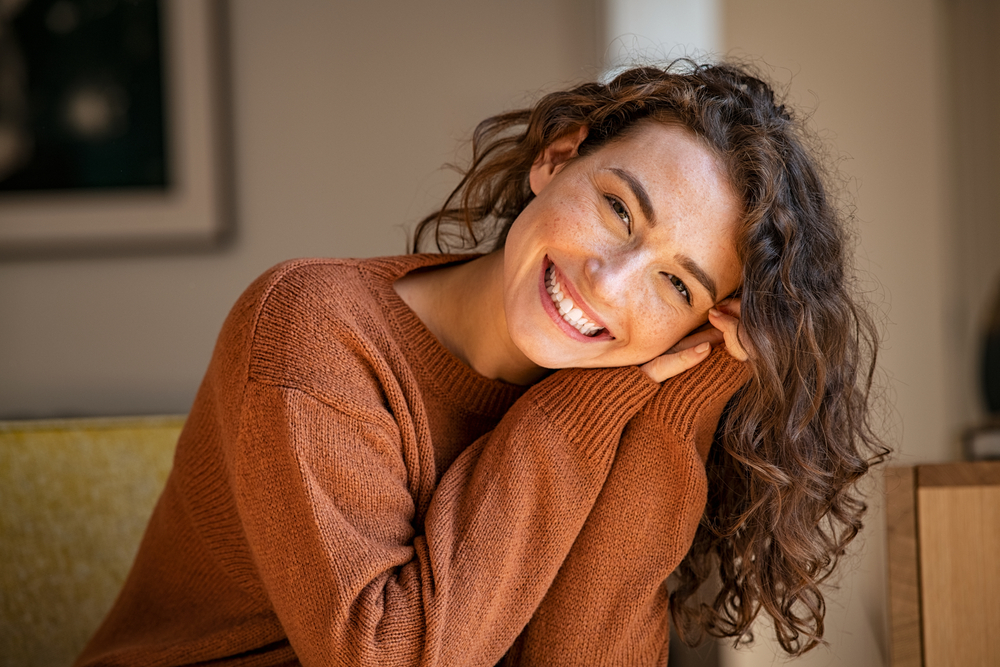 women smiling in a dental care office