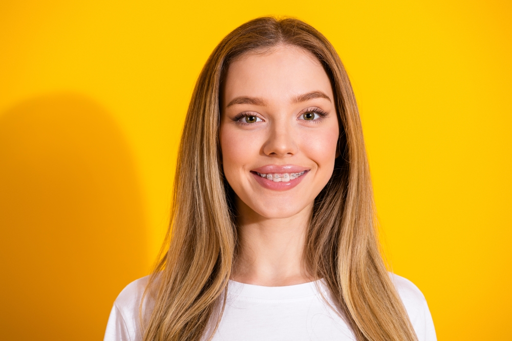 young dental patient smiling with braces